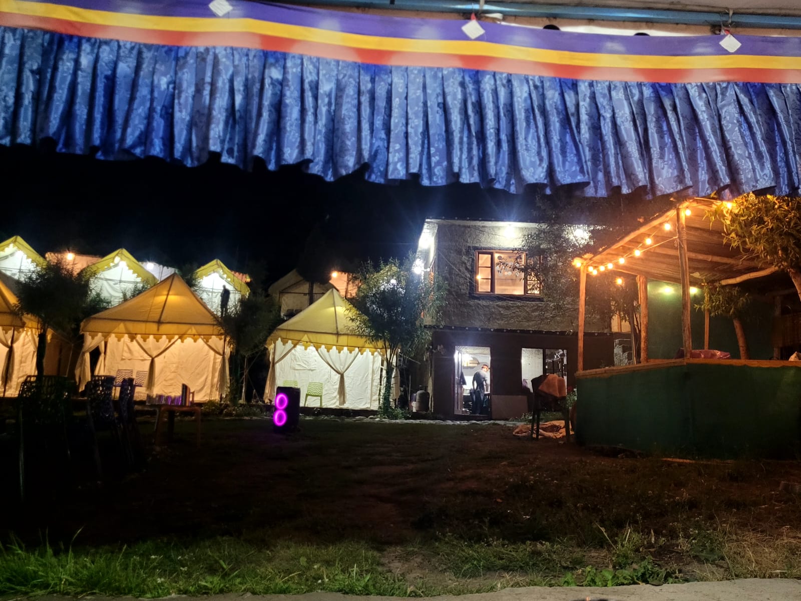 Tent walkway lit up at night